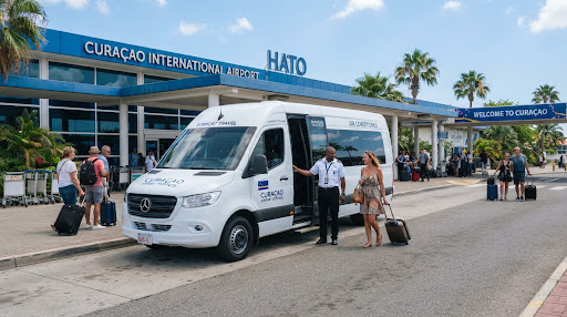Aida Travel Services passenger van at Curaçao airport terminal